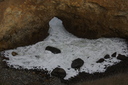 Ocean spilling through a gap in the rocks, Huriawa