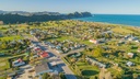 Tolaga Bay Township. Camping area is beachfront, top left.