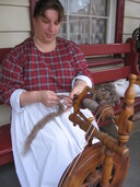 Village lady spinning wool