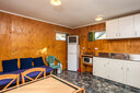 Kitchenette with TV and couch to relax on.