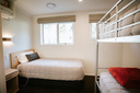 bedroom with single bed & set of bunks