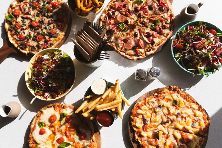 Our On-Site Licensed Cafe offers a daily menu - breakfast, lunch + dinner, cabinet food with fresh baking and specials, as well as a wide range of coffees, alcoholic and non-alcoholic beverages.  